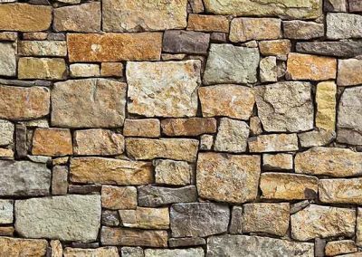 Textura de una pared exterior revestida con piedra natural