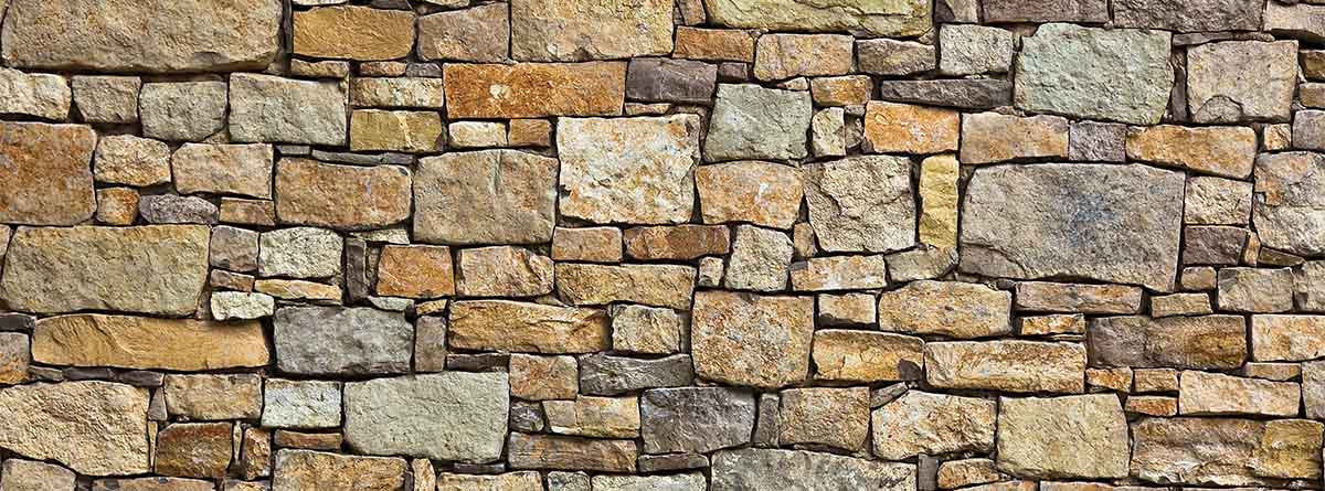 Textura de una pared exterior revestida con piedra natural