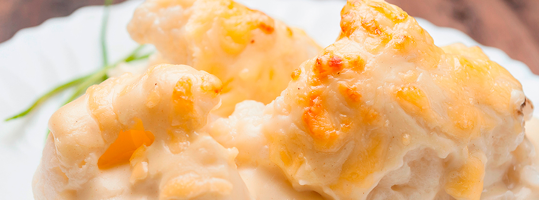 Coliflor con bechamel de jamón serrano y gratinada con queso